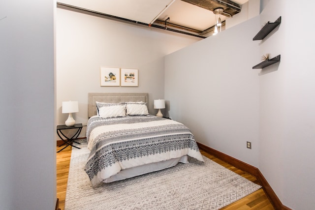 bedroom featuring wood-type flooring