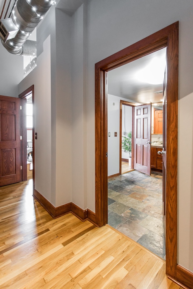 hall with light hardwood / wood-style flooring