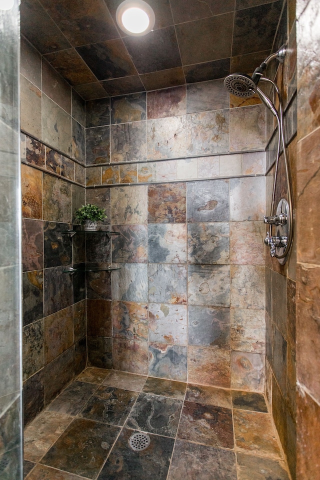 bathroom with tiled shower