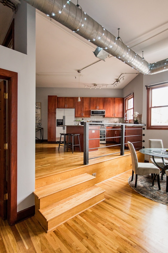 interior space featuring sink and light wood-type flooring