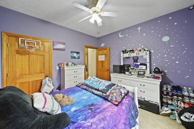 carpeted bedroom with ceiling fan and a textured ceiling