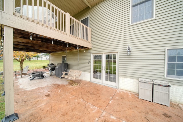 view of patio / terrace with an outdoor fire pit