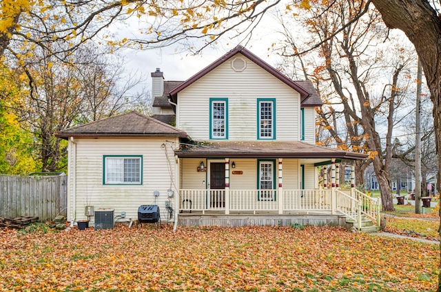 view of front of house with central AC unit and a porch