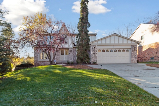 view of front of house with a front lawn and a garage