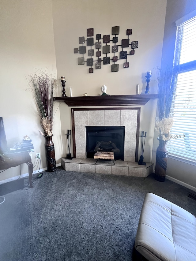 interior details with carpet flooring and a fireplace