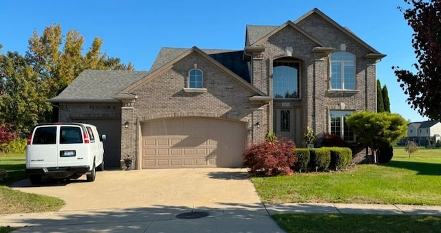 front of property featuring a garage and a front yard