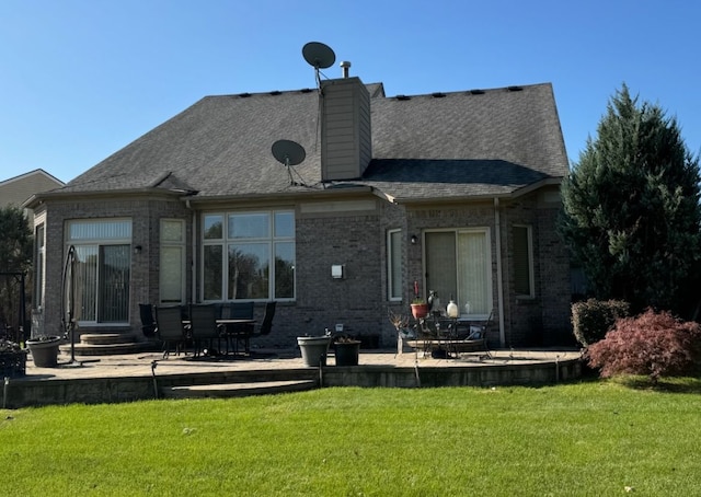 22031 Goldenwillow Dr, Macomb, MI 48044 - rear view of property with a patio, a chimney, a yard, and brick siding