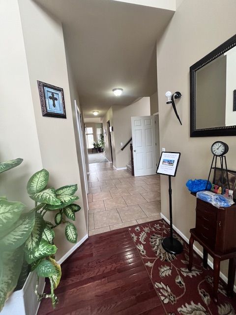 22031 Goldenwillow Dr, Macomb, MI 48044 - hall with baseboards and wood finished floors