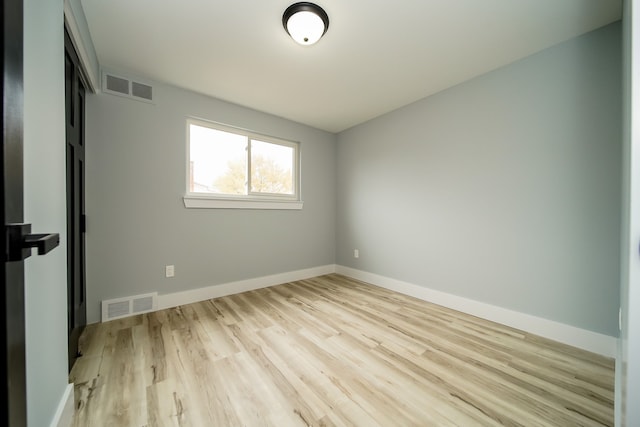 spare room featuring light hardwood / wood-style flooring