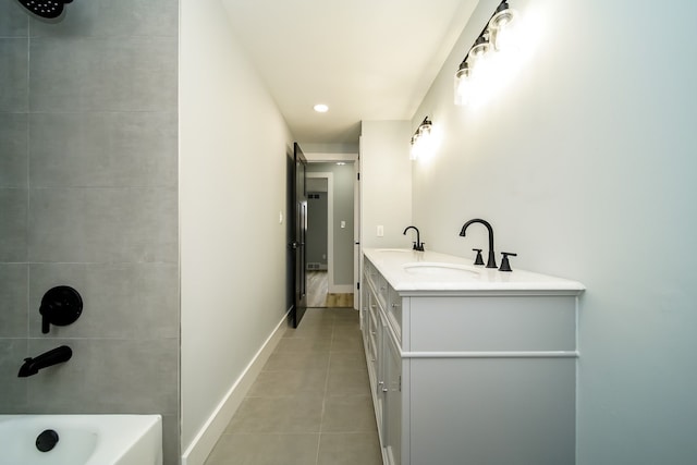 bathroom with tile patterned flooring and vanity