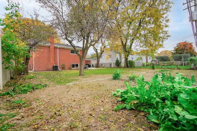 view of yard featuring central air condition unit