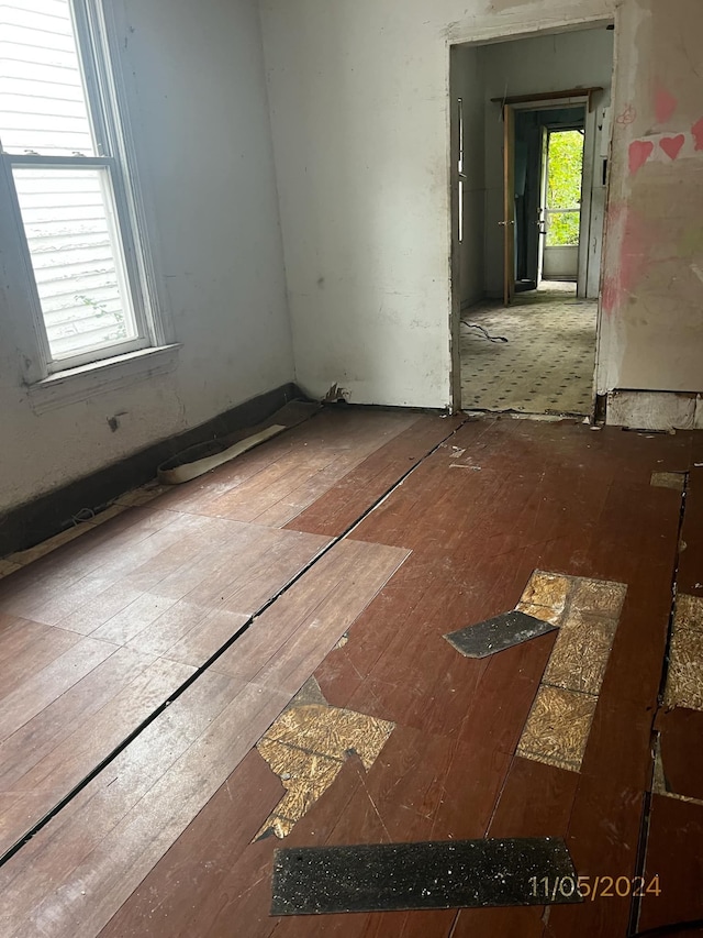 unfurnished room featuring hardwood / wood-style flooring