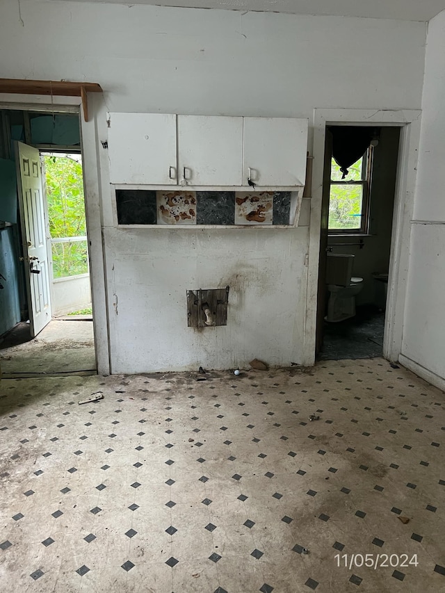 kitchen featuring white cabinets