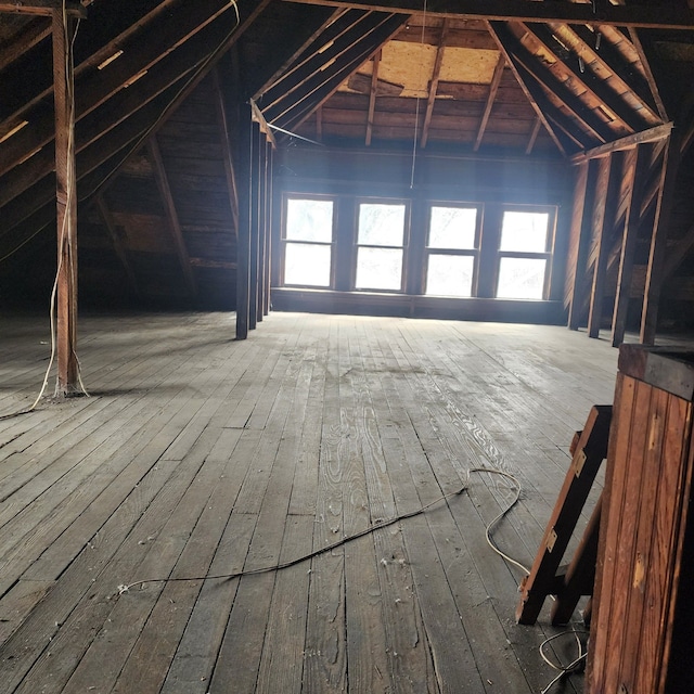 attic featuring a healthy amount of sunlight