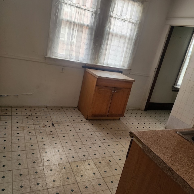 bathroom with tile patterned floors