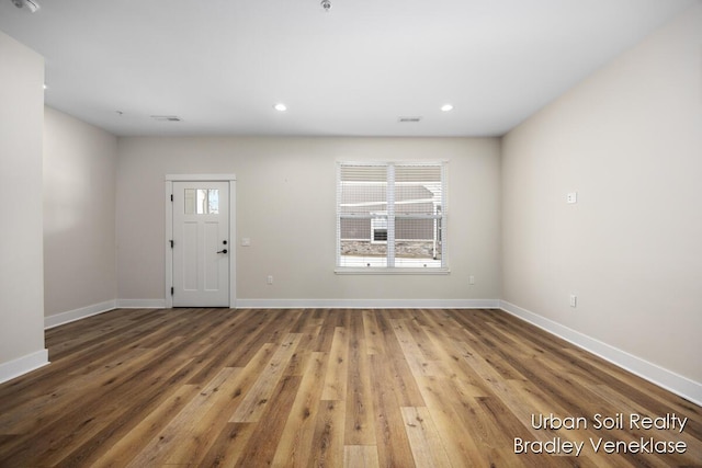 entrance foyer featuring hardwood / wood-style flooring