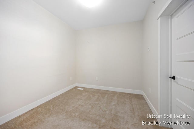 empty room with light colored carpet