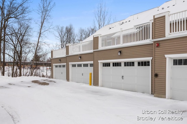 view of snow covered garage