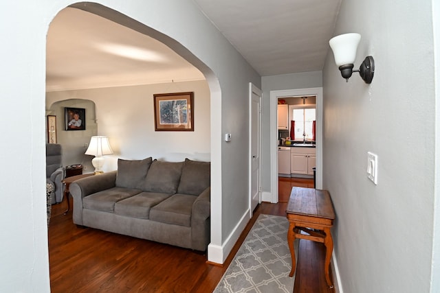 corridor featuring dark hardwood / wood-style flooring and sink