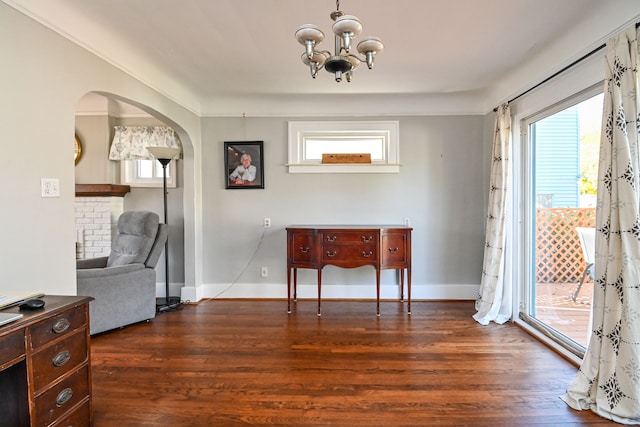 interior space featuring dark hardwood / wood-style floors and a chandelier