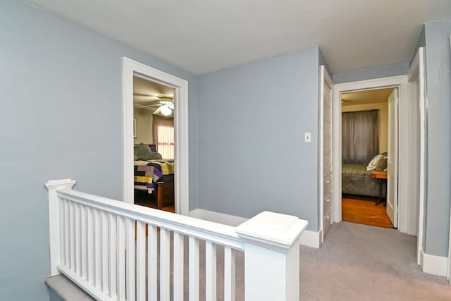 corridor with light colored carpet