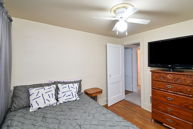 bedroom featuring ceiling fan and light hardwood / wood-style flooring