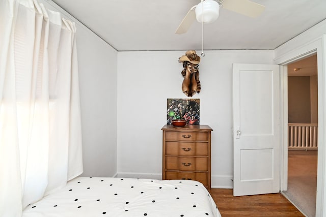 bedroom featuring wood-type flooring and ceiling fan