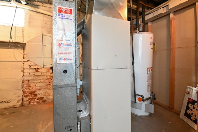 utility room featuring gas water heater