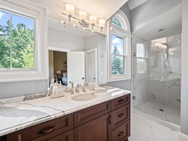 bathroom with vanity and a shower with shower door