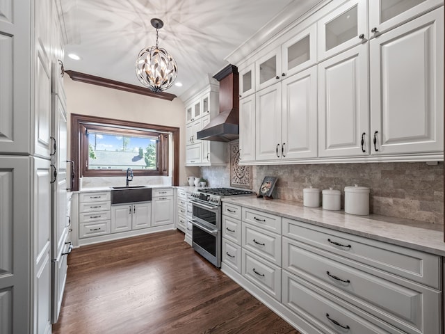 kitchen with white cabinetry, sink, range with two ovens, and custom exhaust hood