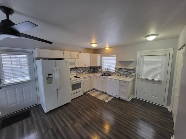 kitchen featuring backsplash, sink, white appliances, white cabinetry, and dark hardwood / wood-style flooring