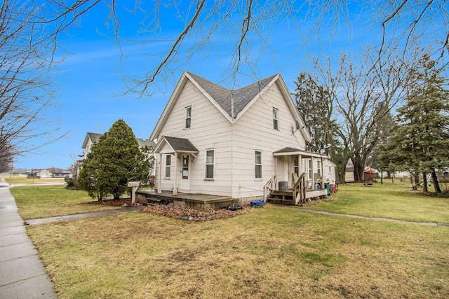 view of side of property with a yard