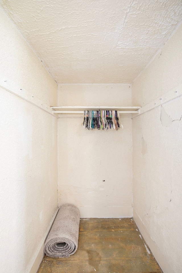 walk in closet featuring dark hardwood / wood-style flooring