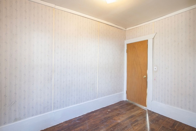 empty room with dark wood-type flooring