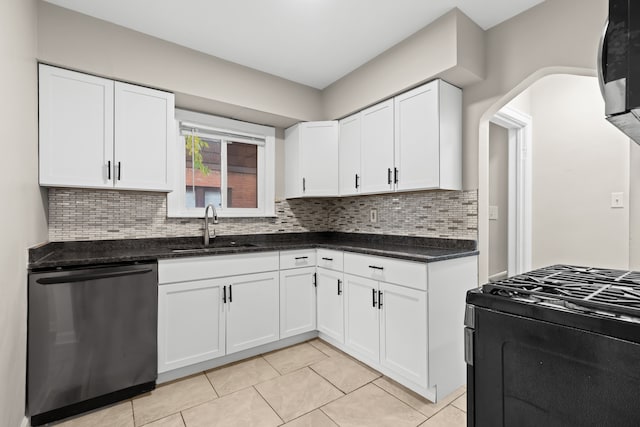 kitchen featuring white cabinets, stainless steel appliances, tasteful backsplash, and sink