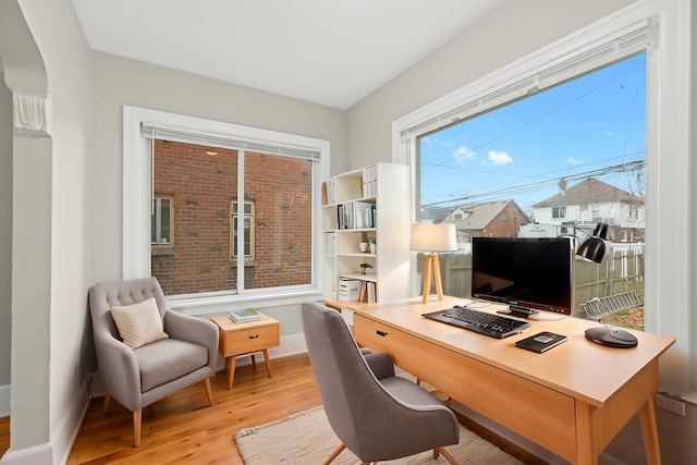 office space with light hardwood / wood-style floors