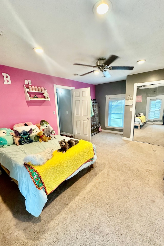 bedroom featuring ceiling fan and carpet floors