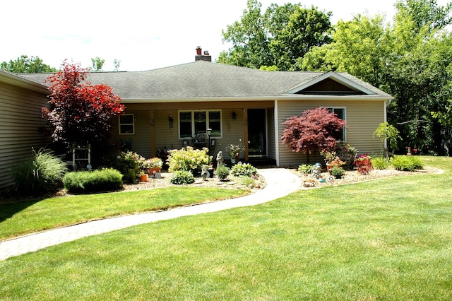 ranch-style house with a front yard and a porch