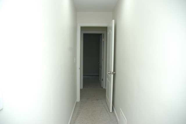 hall with light carpet