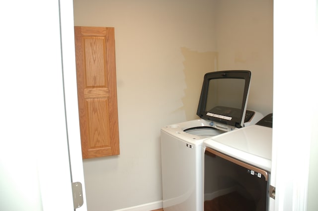 washroom with independent washer and dryer