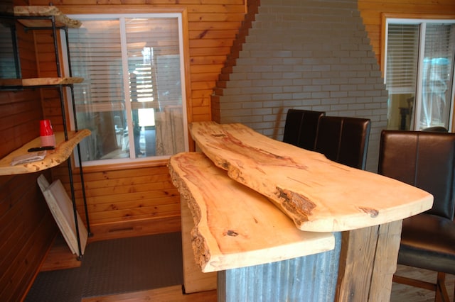 dining room with wooden walls