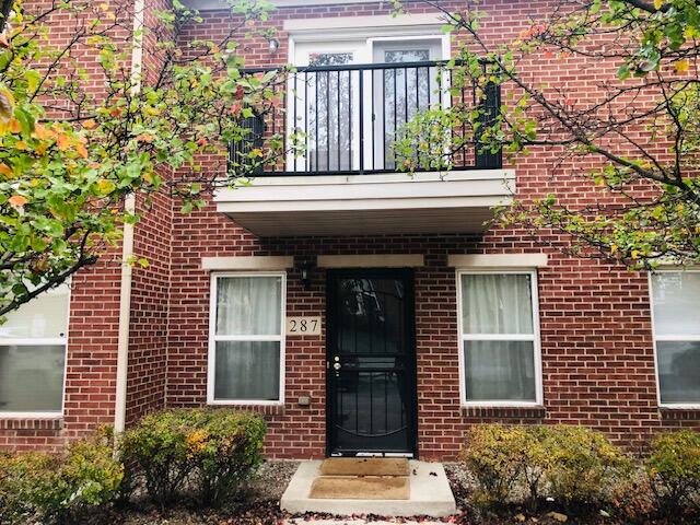 doorway to property with a balcony