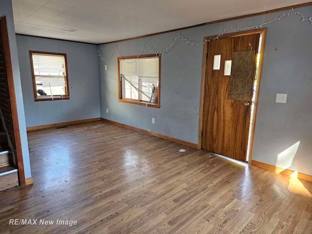 unfurnished room featuring wood-type flooring