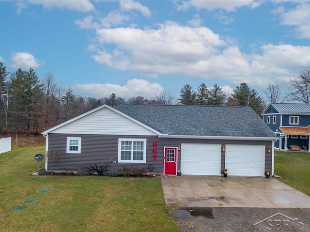 view of front of property with a front lawn and a garage