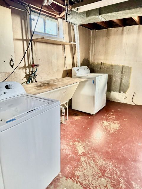 clothes washing area with washer and dryer