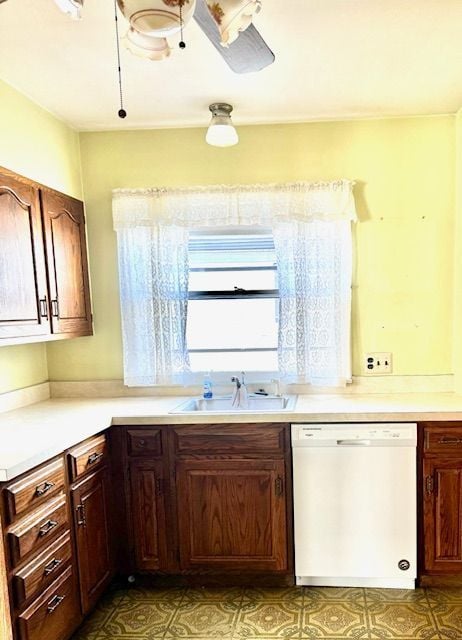 kitchen featuring white dishwasher, ceiling fan, and sink