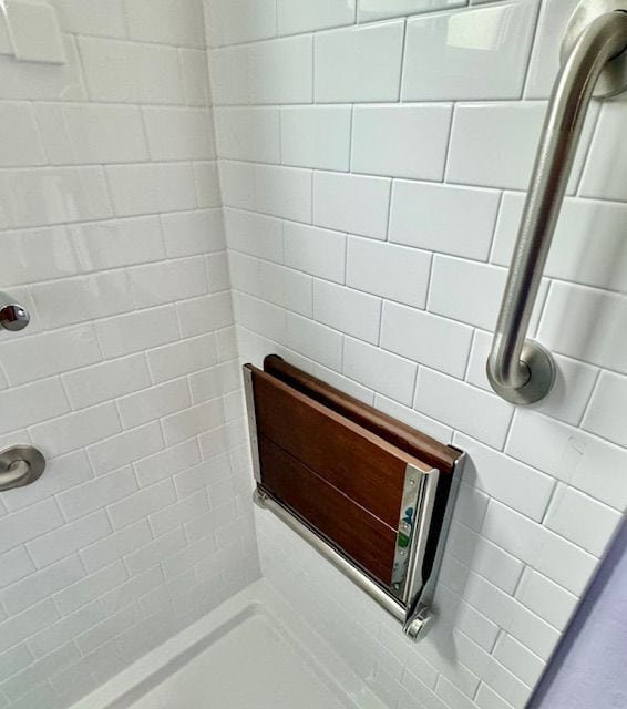 bathroom with a tile shower