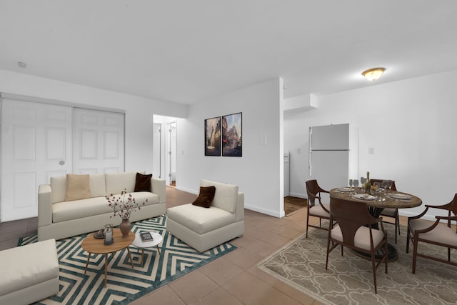 living room with tile patterned flooring