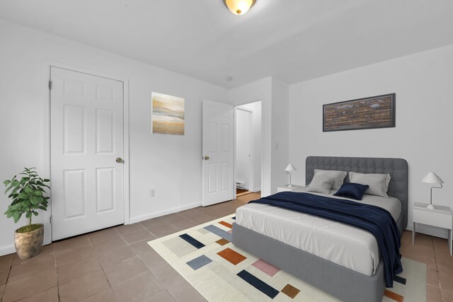 10420 Whittier St, Detroit, MI 48224 - bedroom featuring tile patterned floors and baseboards