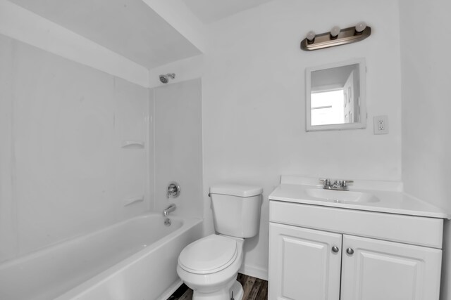 10420 Whittier St, Detroit, MI 48224 - full bathroom with toilet, vanity, shower / bath combination, baseboards, and wood finished floors
